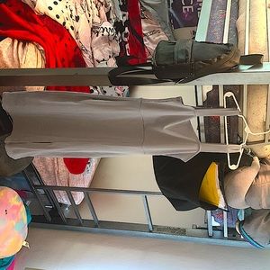 Mid length dress. Baby blue. Has a slit on the thigh. Was never worn.